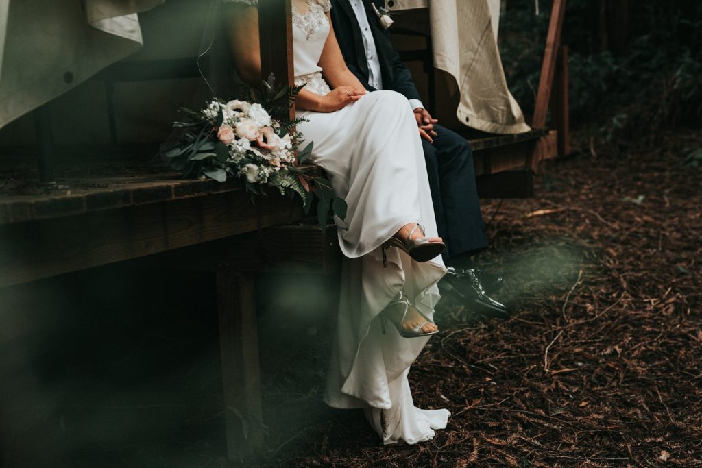 Couple sitting together, holding hands